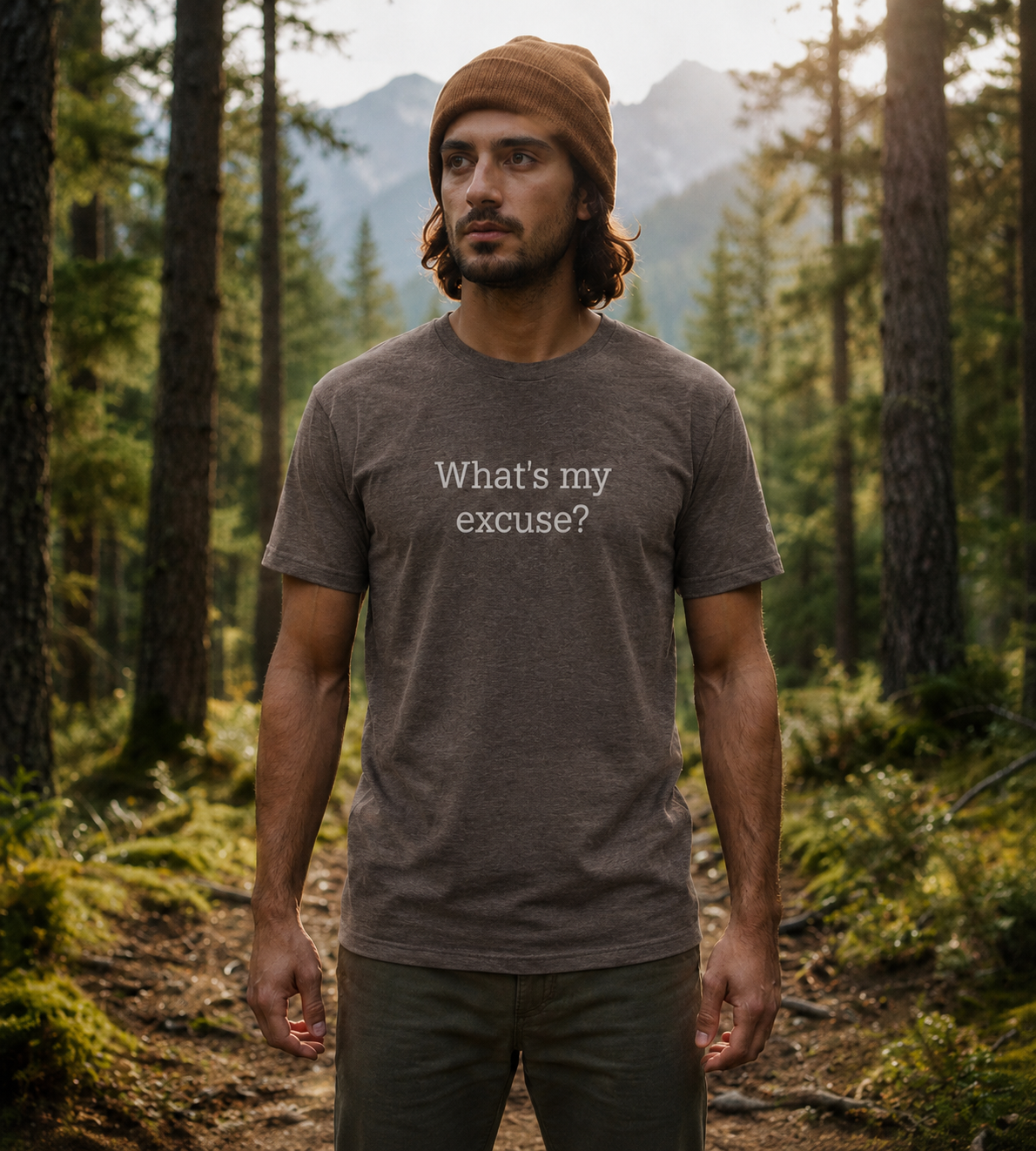 Man wearing a t-shirt with 'What's my excuse?' text in a forest setting