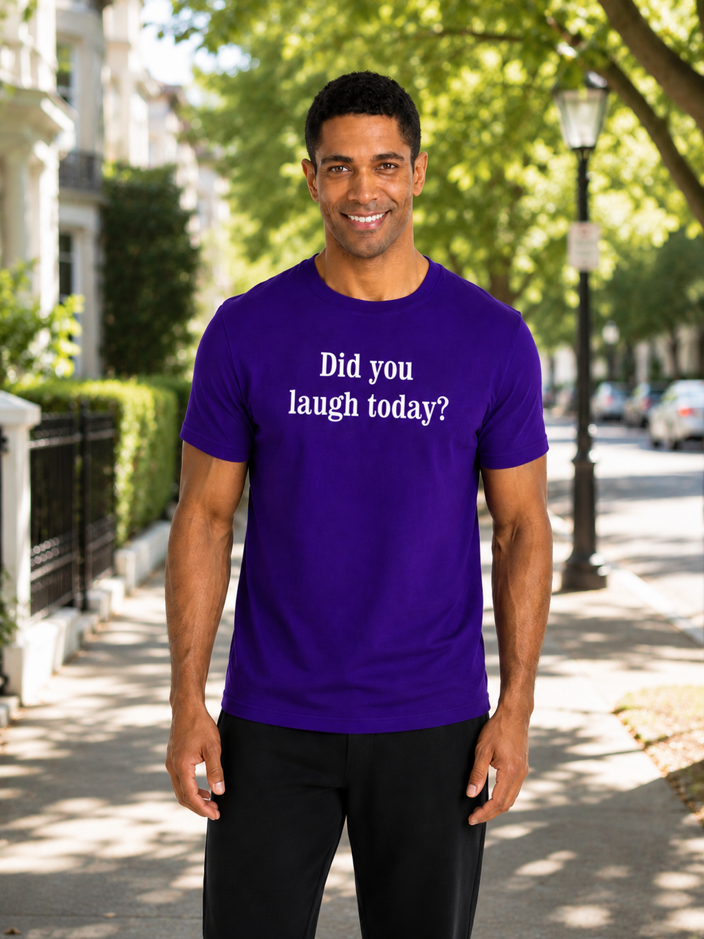 Man wearing a purple t-shirt with text on a street