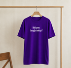 Purple t-shirt with 'Did you laugh today?' text on a wooden hanger against a beige wall.