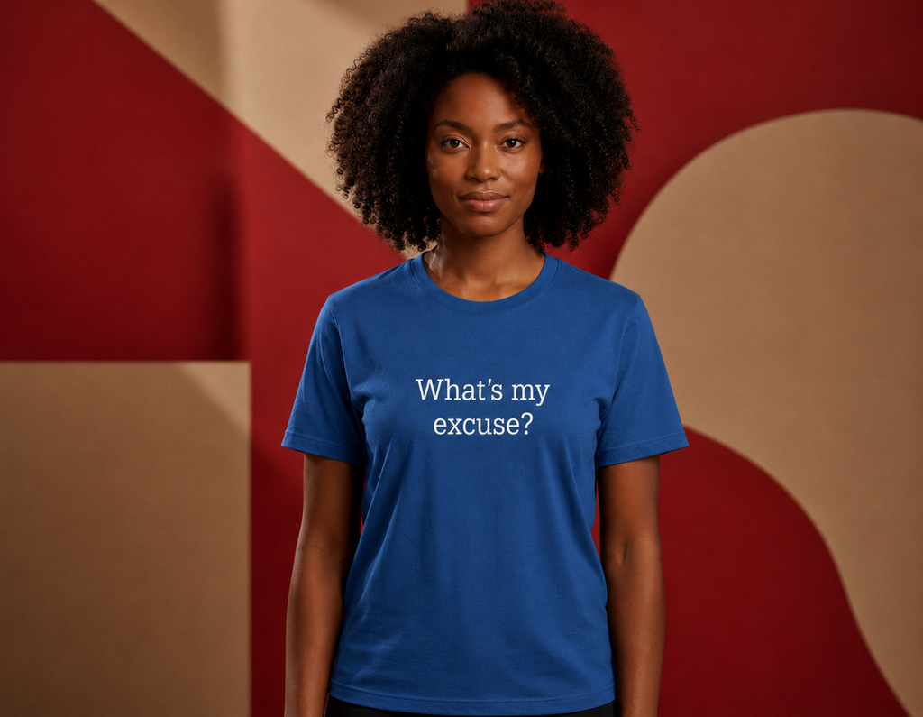 Person wearing a blue t-shirt with text in front of a geometric patterned background