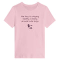 Pink t-shirt with humorous text and emoji on a white background