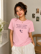A girl wearing "The key to staying healthy" pink T-shirt 